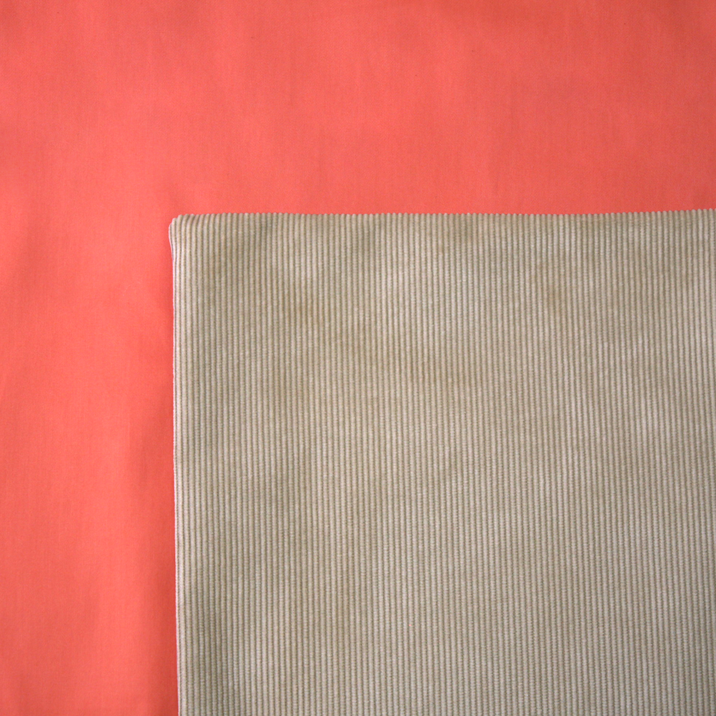 Tan Cord Cushion Cover on a Persimmon Duvet Cover