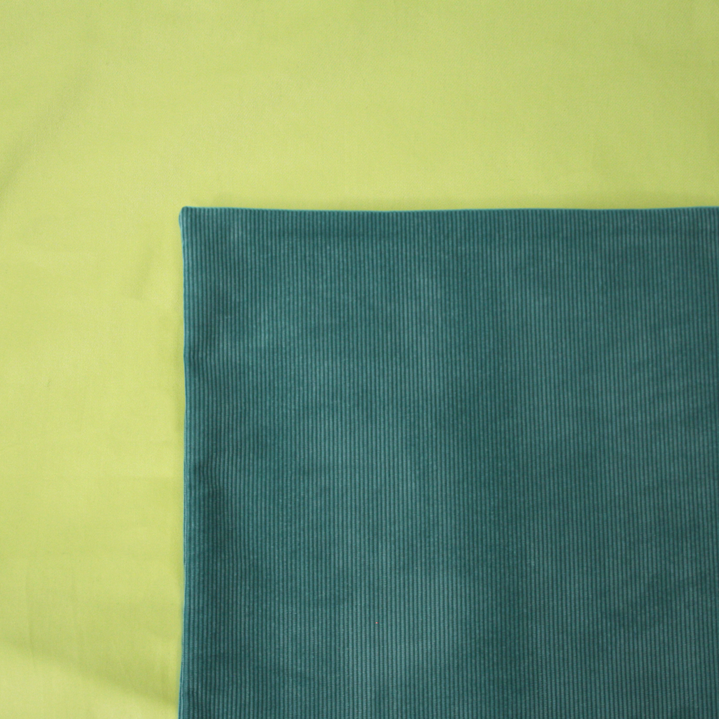 Lagoon Cord Cushion Cover on a Pistachio Duvet Cover
