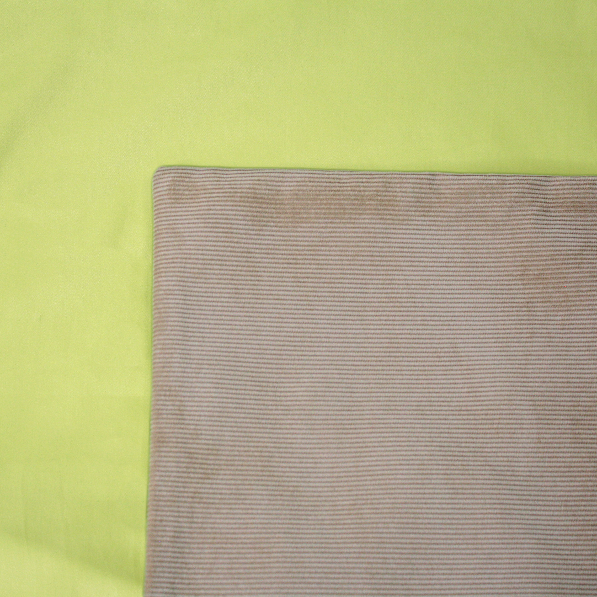 Tan Cord Cushion Cover on a Pistachio Duvet Cover