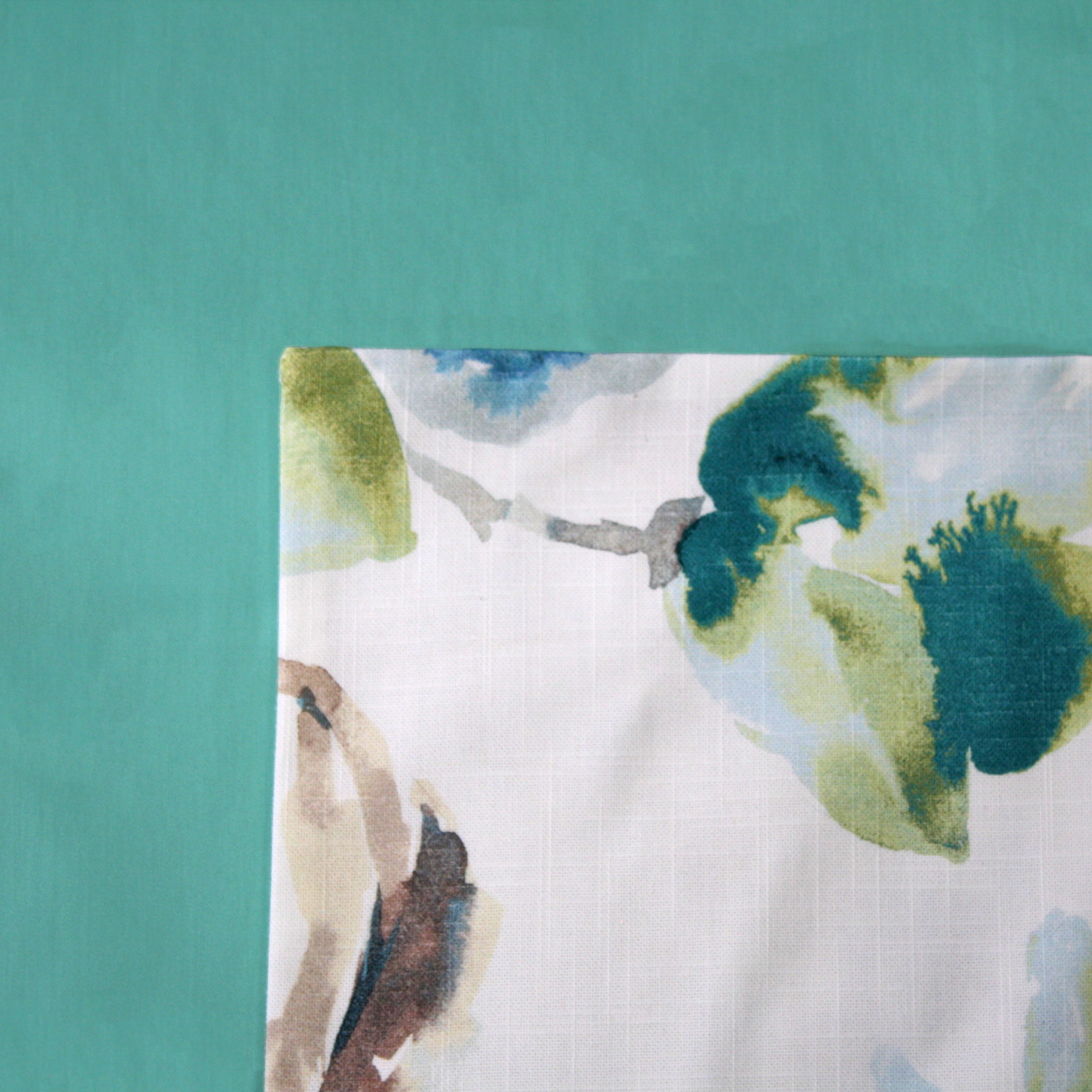 Mist Floral Cushion Cover on a Turquoise Duvet Cover