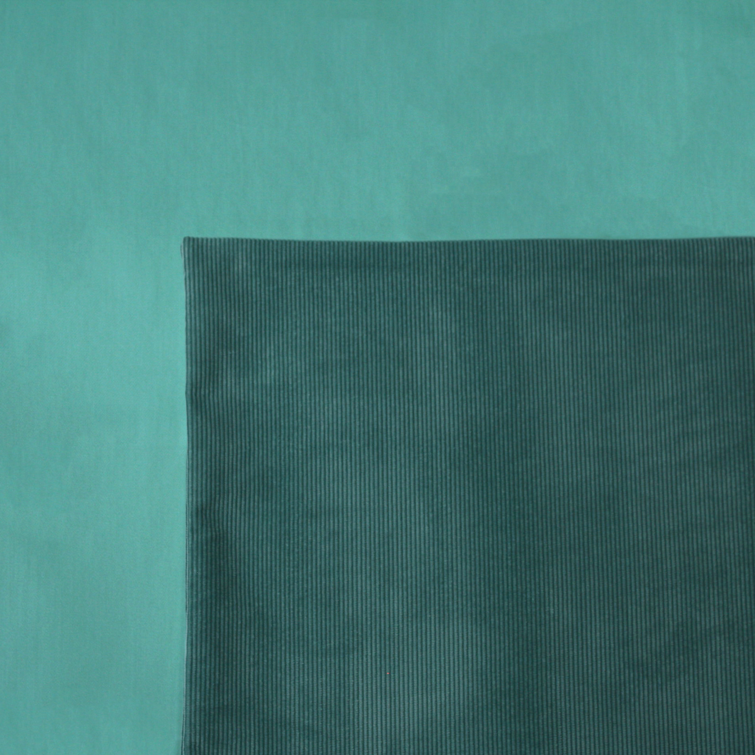 Lagoon Cord Cushion Cover on a Turquoise Duvet Cover